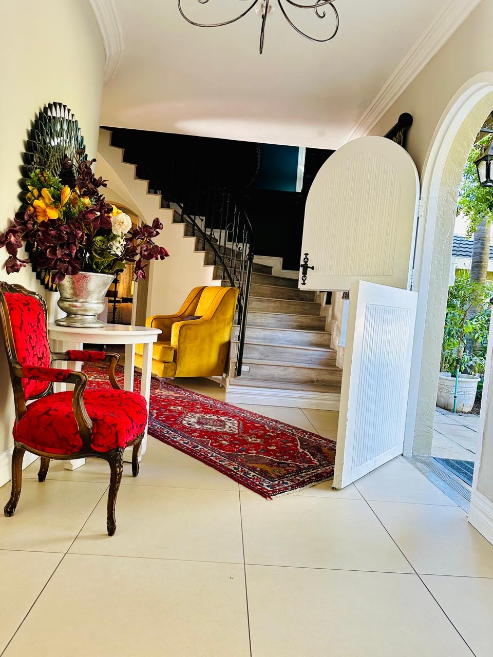 Grand entrance hall with staircase at Cherry Nest